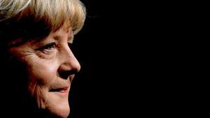 epa10001030 Former German Chancellor Angela Merkel during 'So what is my country?' conversation with Alexander Osang at the Berliner Ensemble in Berlin, Germany, 07 June 2022.  EPA/FILIP SINGER