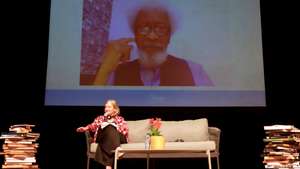 epa09718796 British journalist and writer Rosie Boycott speaks with Nigerian writer Wole Soyinka (on screen), during a conversation as part of the Hay Festival in Cartagena, Colombia, 30 January 2022. Nigerian Wole Soyinka, the first African and the first black writer to win the Nobel Prize for Literature in 1986, spoke about his activism on literature, which he said arose from when he was a child because all his life he has been 'quite curious'. 'As a child I was quite curious, I was always asking and my curiosity took me to my father's library, to anything that was written, it didn't matter what it was', said the writer in a conversation with British journalist Rosie Boycott in the Hay Festival of Cartagena de Indias.  EPA/RICARDO MALDONADO ROZO