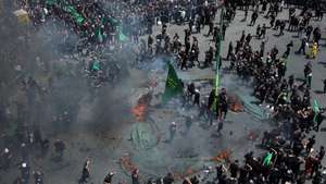 epa12219892 Iranians re-enact the Battle of Karbala during Ashura Day ceremonies in the Galubandak area of Tehran, Iran, 06 July 2025. Shiite Muslims across the world are observing the holy month of Muharram, the first month of the Islamic calendar, which culminates with the celebration of the Ashura, commemorating the martyrdom of Imam Hussein, a grandson of the Prophet Muhammad.  EPA/ABEDIN TAHERKENAREH