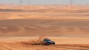 epa10398264 Swedish driver Mattias Ekstrom and co-driver Emil Bergkvist steer their Audi RS Q E-Tron E2 for team Audi Sports during the 9th stage of the Dakar Rally 2023 from Riyadh to Haradh, Saudi Arabia, 10 January 2023.  EPA/Leon Jansen