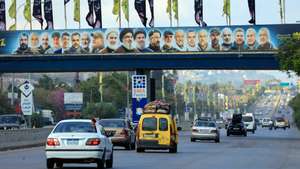 epaselect epa13058692 Lebanese people drive a vehicle loaded with mattresses as they return to their village, passing by pictures of late Hezbollah leaders on the Deir Zahrani highway, southern Lebanon, 23 June 2026, amid a ceasefire between Israel and Hezbollah. A comprehensive joint report by the United Nations Development Programme (UNDP) and the Lebanese National Council for Scientific Research (CNRS-L) estimated direct building damage in South Lebanon at 1.38 billion US dollar. The assessment found over 11,000 buildings completely destroyed and 3.1 million cubic meters of debris, structurally affecting more than 41,000 housing units.  EPA/WAEL HAMZEH