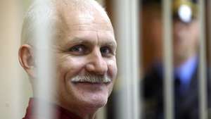 epa10500206 (FILE) - Belarusian human rights activist Ales Bialiatski sits inside a cell in a courtroom during a court session in Minsk, Belarus, 24 November 2011 (reissued 03 March 2023). Bialiatski, leader of Minsk-based human rights group Viasna and 2022 Nobel Peace Prize laureate, was sentenced by a court in Minsk on 03 March 2023 to 10 years in prison, Belarus state media reported, following a trial on charges for financing protests and smuggling money. Bialiatski's deputy Valentin Stefanovich, activist Dmitry Solovyov and lawyer Vladimir Labkovich were also sentenced to 9, 8 and 7 years respectively.  EPA/TATYANA ZENKOVICH *** Local Caption *** 50124965