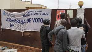 Angolans observe a draft with the election results posted near the polling stations where voting took place for the Angola 2022 general elections, in the municipality of Viana, Luanda, Angola, 25 August 2022. Angola's National Electoral Commission (CNE) announced that the body received no official complaints of alleged irregularities during the process of voting for the country's general elections, which took place on Wednesday. PAULO NOVAIS/LUSA