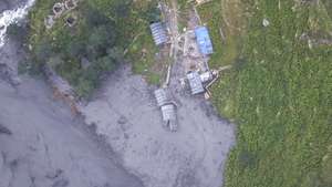 epa13295844 A handout photo made available by the National Trust for Nature Conservation-Manaslu Conservation Area Project (NTNC-MCAP) shows an aerial view of the Budhi Gandaki River swollen by flash floods in Gorkha district, Nepal, 11 October 2026. A debris-laden flash flood has swept away more than a dozen houses and bridges, according to the National Disaster Risk Reduction and Management Authority (NDRRMA).  EPA/NTNC-MCAP/HANDOUT  HANDOUT EDITORIAL USE ONLY/NO SALES