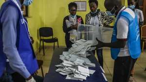 epa10136664 Election officials count the votes after the polls closed in the general elections at a polling station in Luanda, Angola, 24 August 2022. The general elections will define the composition of parliament and the names of the President and Vice President of the Republic.  EPA/PAULO NOVAIS