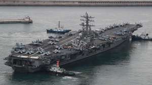epa10206655 The US nuclear-powered aircraft carrier Ronald Reagan sails from a naval base as South Korea and the United States kicked off their first combined naval exercises, involving the American aircraft carrier, near the peninsula in five years, in Busan, southeastern South Korea, 26 September 2022. The four-day drills came as Seoul and Washington are cranking up security cooperation amid continued speculation that North Korea could engage in provocative acts, like a nuclear test or submarine-launched ballistic missile launch.  EPA/YONHAP SOUTH KOREA OUT