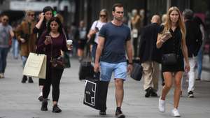 epa08654347 Pedestrians walk along the busy shopping area of Oxford Street in London, Britain, 08 September 2020. British Health Secretary Matt Hancock has urged young people to stick to physical distancing rules, due to the the rise in the number of coronavirus cases.  EPA/NEIL HALL