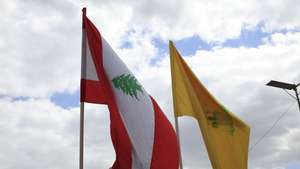 epa12897114 The flags of (L-R) Lebanon and Hezbollah flutter during a solidarity rally with Hezbollah following a Lebanon-Israel ceasefire, in Sana'a, Yemen, 17 April 2026. Thousands of Houthi supporters rallied in Sana'a to voice solidarity with Hezbollah and the people of Lebanon, a day after Lebanon and Israel agreed to a 10-day ceasefire.  EPA/YAHYA ARHAB