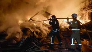 epa13336215 Ukrainian rescuers work at the site of a Russian strike in a residential area in Kharkiv, Ukraine, late 27 October 2026 (issued on 28 October 2026), amid the ongoing Russian invasion. At least five people were injured, including one child, during the overnight drone attack in Kharkiv, according to the State Emergency Service report.  EPA/SERGEY KOZLOV