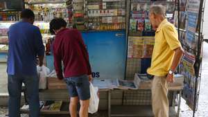 epa04307591 People check the front pages of the newspapers in Rio De Janeiro, Brazil, 09 July 2014. Brazilian media had nothing but harsh words for the national football team on 09 July, one day after Germany beat the hosts 7-1 in the World Cup semi-final and ended their hopes of a sixth title.  EPA/KAMIL KRZACZYNSKI