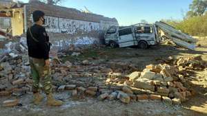 epa11941624 A Pakistani security official inspects the scene of a suicide bomb attack in Bannu, Khyber Pakhtunkhwa (KPK) province, Pakistan, 05 March 2025. Suspected insurgents attacked an army base in Bannu district, northwestern Pakistan, killing at least 12 civilians and wounding many others on the evening of 04 March, police said. According to authorities, two suicide bombers detonated explosive-laden vehicles at the cantonment around 6:30 p.m., causing massive explosions that destroyed nearby houses and mosques, with the Pakistani Taliban-affiliated group Jaish Al-Fursan claiming responsibility for the attack.  EPA/ABDULLAH KHAN