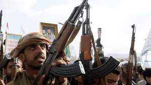 epa13103391 Houthi supporters hold up their weapons during a protest in solidarity with the Iranian people, and against US airstrikes on Iran, in Sana'a, Yemen, 10 July 2026. The US military resumed strikes against Iranian targets on 08 July, shattering the interim ceasefire between the two nations.  EPA/YAHYA ARHAB
