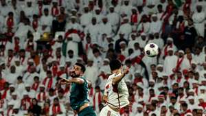 epa12523888 Aymen Hussein (L) of Iraq and Lucas Pimenta of the UAE in action during the FIFA World Cup 2026 Asian qualifiers play-off 1st leg soccer match between UAE and Iraq in Abu Dhabi, United Arab Emirates, 13 November 2025.  EPA/ALI HAIDER