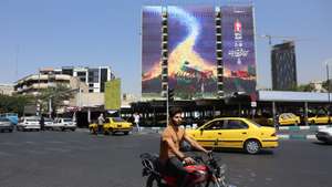 epa13071943 Iranians drive past a billboard for the upcoming funeral of Iran's late Supreme Leader Ayatollah Ali Khamenei  in Vanak Square, Tehran, Iran, 29 June 2026. Iran is set to hold a multi-day mass funeral for the late supreme leader, amid heightened regional tensions following recent exchanges of fire between Iran and the US despite a recently signed agreement.  EPA/ABEDIN TAHERKENAREH RESTRICTIONS: NO Access Israel Media/Persian Language TV Stations Outside Iran/Strictly No Access BBC Persian/VOA Persian/Manoto TV/Iran International TV. (As mandated by Iran's Directorate General for Foreign Media) --