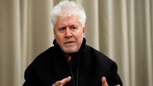 epa09600265 Spanish film director Pedro Almodovar poses for EFE news agency at the headquarters of the author's rights management entity for screenwriters and directors (DAMA) in Madrid, central Spain, 23 November 2021 (released 24 November). Almodovar has converted his latest script, that of the film 'Parallel Mothers', which intersects the theme of motherhood and female sisterhood with the mass graves of the Civil War, into a book that will go on sale on 25 November.  EPA/MARISCAL
