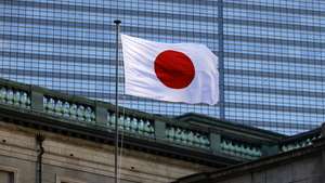 epa12635979 The Japanese national flag flutters at the Bank of Japan (BOJ) headquaters in Tokyo, Japan, 08 January 2026. The Bank of Japan is continuing to nominally raise their interest rates from near zero, in December 2025 raising rates 25 basis points.  EPA/FRANCK ROBICHON