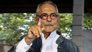 epa09896750 East Timor's presidential candidate and former president Jose Ramos Horta shows his marked finger after casting his vote during the presidential runoff election at a polling station in Dili, East Timor, also known as Timor Leste, 19 April 2022. People in Timor Leste vote for their next president in a runoff election between former president and Nobel Peace Prize laureate Jose Ramos Horta, and incumbent president Francisco Guterres.  EPA/ANTONIO DASIPARU