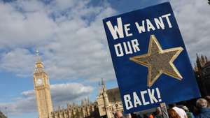 epa10878912 A person holds a placard in Parliament Square during the 'Rejoin' march in central London, Britain, 23 September 2023. This was the second national rejoin march calling for the United Kingdom to rejoin the European Union.  EPA/ISABEL INFANTES