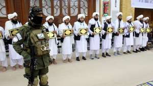 epa10515254 A Taliban security stands guard during a graduation ceremony in Kandahar, Afghanistan, 11 March 2023. Some 33 students graduated in the field of Islamic justice system for the first time in Kandahar.  EPA/STRINGER