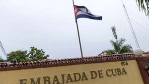 epa13167672 A Cuban flag flutters in the wind at the Cuban Embassy in Santo Domingo, Dominican Republic, 13 August 2026. The Dominican government formally requested on 13 August that the Cuban Embassy in the country withdraw nine members of its diplomatic mission and their family members, granting a seven-day period for this purpose, the Ministry of Foreign Affairs said in a statement.  EPA/ORLANDO BARRIA