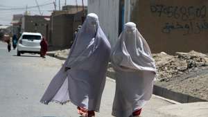 epa11560358 Burqa-clad Afghan women walk on a road in Kandahar, Afghanistan, 22 August 2024. The Taliban in Afghanistan have enforced new laws mandating that women must cover their bodies and faces in public, citing these measures as necessary to promote virtue and prevent vice, the Ministry for the Propagation of Virtue and Prevention of Vice said. Approved by their Supreme Leader Hibatullah Akhundzada, the regulations include restrictions on women's voices in public, the prohibition of images of living beings, and bans on music and mixed-gender interactions. The measures have drawn criticism from the United Nations (UN) for fostering fear and intimidation, especially among women and girls, as the Taliban's Ministry for the Propagation of Virtue and Prevention of Vice expands its control over public life.  EPA/QUDRATULLAH RAZWAN