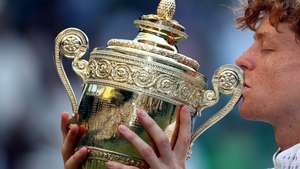 epaselect epa13107537 Jannik Sinner of Italy celebrates with the trophy after winning the Men's Singles final against Alexander Zverev of Germany at the Wimbledon Championships in London, Britain, 12 July 2026.  EPA/NEIL HALL