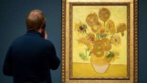 epa07395993 The painting 'Zonnebloemen' (Sunflowers) from 1889 by Dutch artist Vincent van Gogh is back at its place in the Van Gogh Museum in Amsterdam, The Netherlands, 25 February 2019, after extensive research and restoration works. The world-famous canvas will be at the heart of the exhibition Van Gogh and Sunflowers in summer 2019, in which the research and restoration will be explained in detail.  EPA/KOEN VAN WEEL