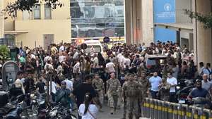 epa11609842 Lebanese soldiers and Hezbollah members gather outside a hospital where injured people were being transported, following an incident involving Hezbollah membersâ€™ wireless devices in Dahieh, Beirut, south Lebanon, 17 September 2024. According to Lebanonâ€™s state news agency, several â€˜wireless communication devices (pagers) were detonated using advanced technology.â€™ Several people with various injuries have been arriving at Lebanese hospitals, according to the Lebanese Public Health Emergency Operations Center of the Ministry of Public Health.  EPA/WAEL HAMZEH