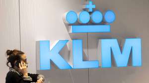 epa08955999 A KLM staff checks her watch at a check-in desk at Schiphol Airport, the Netherlands, 21 January 2021. Another 800 to 1000 jobs will be lost at KLM as a result of the coronavirus pandemic crisis. Earlier, 5,000 jobs had been lost at the airline.  EPA/EVERT ELZINGA