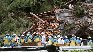 epa11568340 Rescue workers search for missing residents amid the ruins of a house collapsed due to heavy rain triggered by typhoon Shanshan in Gamagori, Aichi Prefecture, central Japan, 28 August 2024. Two of the five-member family buried by the landslide were rescued. The Japan Meteorological Agency on 28 August issued a special warning for strong winds, high waves, high tides and heavy rain for southwestern Japan as typhoon Shanshan is approaching Kagoshima Prefecture. The typhoon is expected to make landfall on southern Kyushu toward 29 August, the agency said. Japan&#039;s Shinkansen bullet train services are expected to be suspended from late 28 August, while airlines have already announced to cancel about 200 flights on 28 and 29 August.  EPA/JIJI PRESS JAPAN OUT EDITORIAL USE ONLY