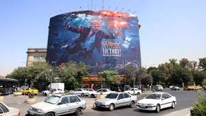 epa13188122 Iranians drive past an anti-US billboard featuring US President Donald Trump in southern Tehran, Iran, 24 August 2026. US President Donald Trump said the US will launch 'economic D-Day' sanctions against Iran as the conflict between Iran and the US continues.  EPA/ABEDIN TAHERKENAREH RESTRICTIONS: NO Access Israel Media/Persian Language TV Stations Outside Iran/Strictly No Access BBC Persian/VOA Persian/Manoto TV/Iran International TV. (As mandated by Iran's Directorate General for Foreign Media) --