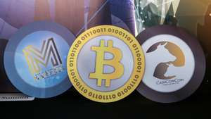 epa09485704 (FILE) - Logos of (L-R) the World Blockchain Marvels, and cryptocurrencies Bitcoin, and CashCowCoin are displayed during the World Blockchain Marvels in Hong Kong, China, 24 August 2018 (reissued 24 September 2021). China's People's Bank on 24 September 2021 in a statement said that "Virtual currency-related business activities are illegal financial activities."  EPA/JEROME FAVRE *** Local Caption *** 54572171