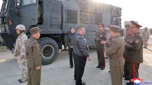 epa12901466 A photo released by the official North Korean Central News Agency (KCNA) shows North Korean leader Kim Jong Un (Centre front) and his daughter, Kim Ju Ae (Centre back), attending the test-fire of an improved Hwasongpho-11 Ra surface-to-surface tactical ballistic missile at an undisclosed location in North Korea, 19 April 2026 (issued 20 April 2026). According to KCNA, five missiles were launched toward an island target roughly 136 km away to verify the characteristics and efficacy of cluster and fragmentation mine warheads integrated into the tactical system.  EPA/KCNA  EDITORIAL USE ONLY