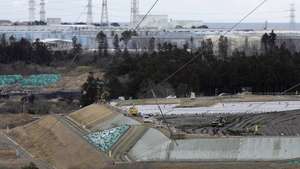 epa10470390 Reactor houses of No. 5 (R) and 6 at Tokyo Electric Power Company (TEPCO)'s Fukushima Daiichi Nuclear Power Plant, which is under the decommissioning work, are seen over storage tanks of decontaminated water through purification system ALPS at the power plant and an interim storage facility of soil and waste removed in off-site decontamination work in Fukushima Prefecture in Okuma, Fukushima Prefecture northern Japan, 14 February 2023 (issued 16 February 2023). Japan will mark the twelfth anniversary of the nuclear accident at TEPCO's Fukushima Daiichi Nuclear Power Plant following a magnitude 9.0 earthquake hitting its northern area. The government approved a plan in 2022 to release the decontaminated water into the sea, starting spring of 2023.  EPA/KIMIMASA MAYAMA ATTENTION: This Image is part of a PHOTO SET