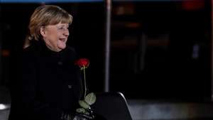 epa09617400 German Chancellor Angela Merkel (C) attends the military grand tattoo in her honor at the defense ministry in Berlin, Germany, 02 December 2021.  Acting German Chancellor Angela Merkel receives on 02 December 2021, on the occasion of her farewell, a Grand Tattoo of the German Federal Armed Forces (Bundeswehr).  EPA/FILIP SINGER