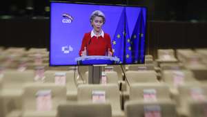 epa08830651 A tiltshift lens image of European Commission President Ursula Von Der Leyen seen on a screen as she along with European Council President Charles Michel (unseen) give a joint press briefing ahead of a G20 online meeting, in Brussels, Belgium, 20 November 2020. The G20 Leaders’ Summit will be held virtually on 21 and 22 November and is organized by Saudi Arabia's current G20 Presidency.  EPA/OLIVIER HOSLET / POOL