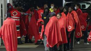 epa13045856 Several migrants arrive at the port in the city of Arrecife, Lanzarote Island, Canary Islands, Spain, early on 18 June 2026. A Spanish sea rescue ship intercepted a boat with some 70 migrants on board off Lanzarote Island's eastern coast.  EPA/Adriel Perdomo