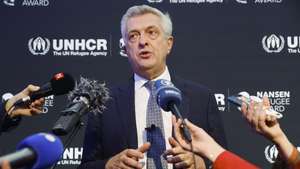 epa10235146 United Nations High Commissioner for Refugees Filippo Grandi speaks before Angela Merkel receives the UNHCR Nansen Refugee Award for protecting refugees at the height of the Syria crisis, during a ceremony in Geneva, Switzerland, 10 October 2022.  EPA/STEFAN WERMUTH / POOL