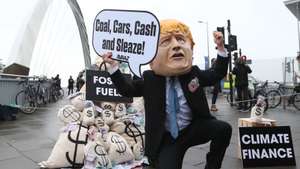 epa09578737 Protesters attend a demonstration during the COP26 UN Climate Summit in Glasgow, Britain 12 November 2021. The 2021 United Nations Climate Change Conference (COP26) runs from 31 October to 12 November 2021 in Glasgow.  EPA/ROBERT PERRY