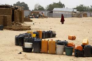epa09084514 Empty plastic containers are arranged in line to fetch water at a bore-point seen at an internal displaced people's camp in Maiduguri, northeast Nigeria, 19 March 2021. Boko Haram crisis, which has lasted more than 10 years in Nigeria's northeast, has targeted more women and children for abduction, forced conversion to Islam, physical and psychological abuses, forced labour and marriage. Although Boko Haram's violence against women and children has been at the center of global attention since its inception, delivery of protection and supports for domestic needs for the IDPs have been huge challenges that many institutional support groups are facing.  EPA/AKINTUNDE AKINLEYE