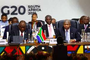 epa12541528 South African President Cyril Ramaphosa (L) and Chairperson of the African Union Joao Lourenco attend a plenary session on the opening day of the G20 Leaders' Summit at the Nasrec Expo Centre in Johannesburg, South Africa, 22 November 2025. World leaders are gathering in South Africa, the host of this year's G20 Leaders' Summit on 22 and 23 November 2025, to discuss the global economy, development and financing.  EPA/THOMAS MUKOYA / POOL