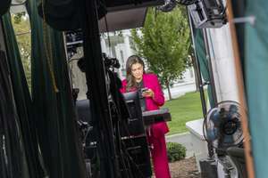 epa13249014 CNN Senior White House Correspondent Kristen Holmes works in the CNN standup booth on the North Lawn of the White House in Washington, DC, USA, 18 September 2026. US President Trump said that CNN, MS NOW and Politico would no longer be allowed access to the White House events, citing what he described as unfair and inaccurate coverage of his administration.  EPA/SHAWN THEW