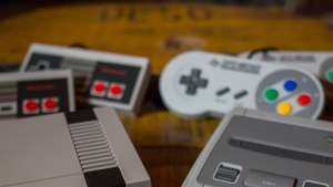 A NES (Nintendo Entertainment System) Classic Mini (L) and a