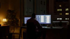 Businessman using computer late at night