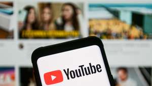 In this photo illustration a YouTube logo seen displayed on