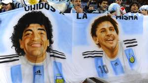 Argentina supporters hold a banner showi