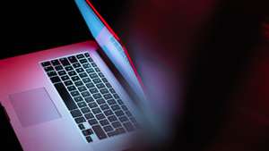 Cyber attack, laptop computer being infected by virus