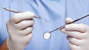 Dentist doing dental examination