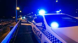 Police car patrol on road of Madrid during night