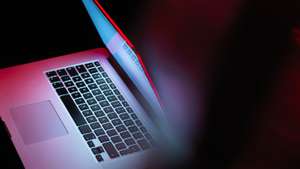 Cyber attack, laptop computer being infected by virus